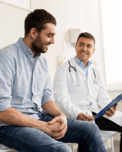HIV Prevention talk - A man sitting next to a male doctor both smiling