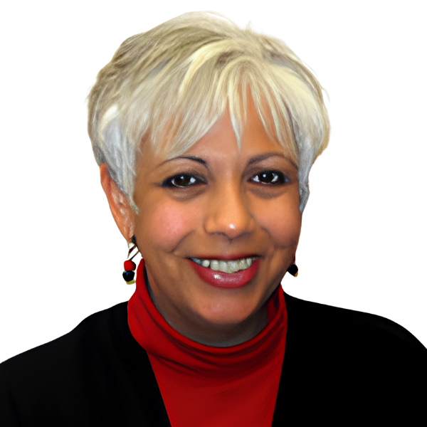 Photo of Ana Garcia, an older woman. She has short, white or very light gray hair styled in a soft, feathered cut.