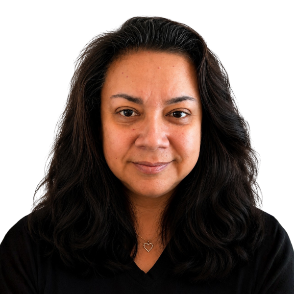 A photo of Ethel Alvarado, MSW. LCSW, a woman with long, wavy dark hair smiles softly, wearing a black top and a heart-shaped necklace.