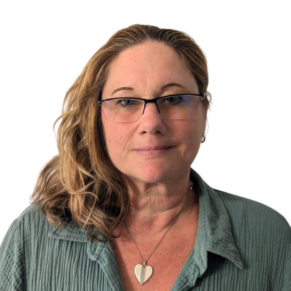 Nicole Ann Curry. LMHC, Clinical Counselor II A photo of Nicole Curry, LMHC, Clinical Counselor II, a woman with long brown hair tied back, wearing a blue top and black jacket, smiles softly against a plain white background.